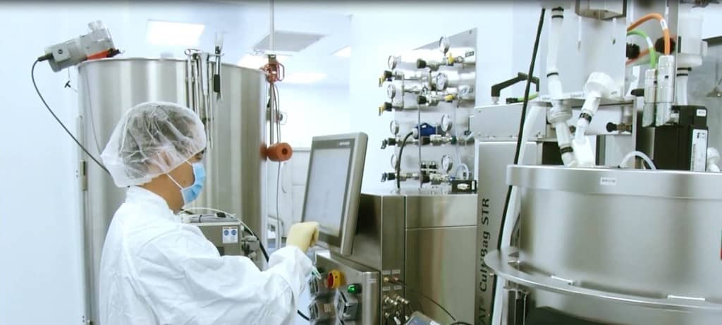 An image showing a facility employee working with bioreactors at Avid Bioservices' new viral vector & adenovirus manufacturing facility in California, USA