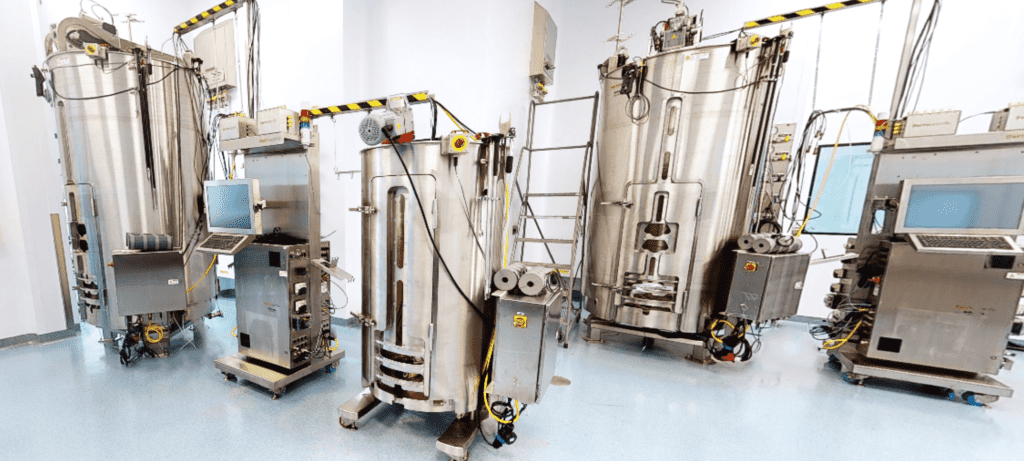 Image depicting large bioreactors used in Avid's biologics contract manufacturing