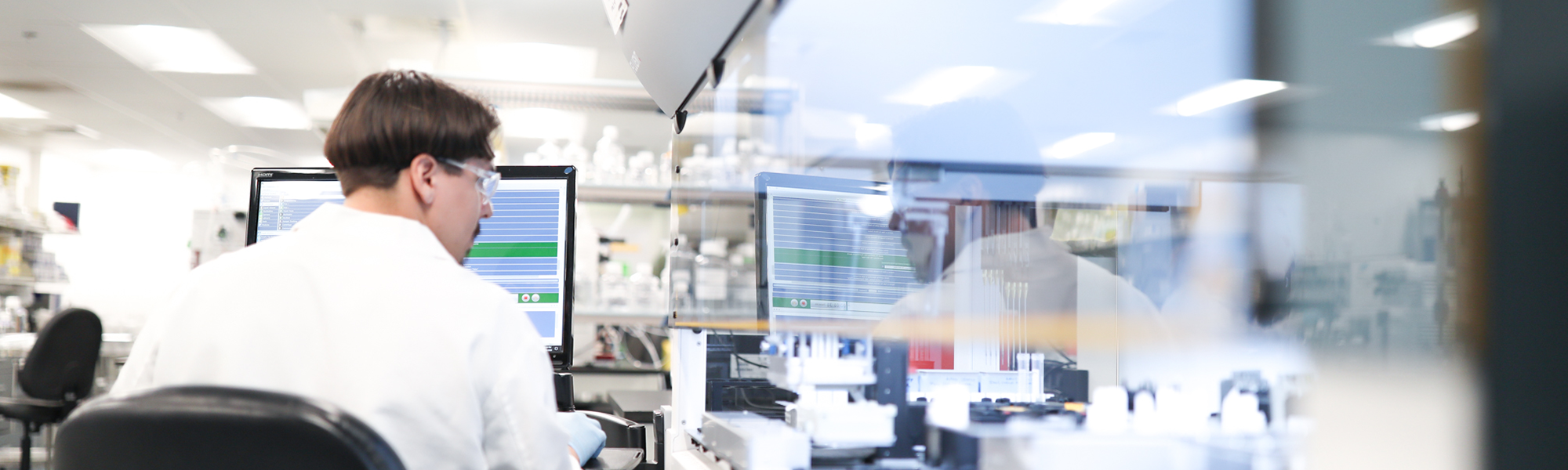 Man working at a computer workstation in a laboratory