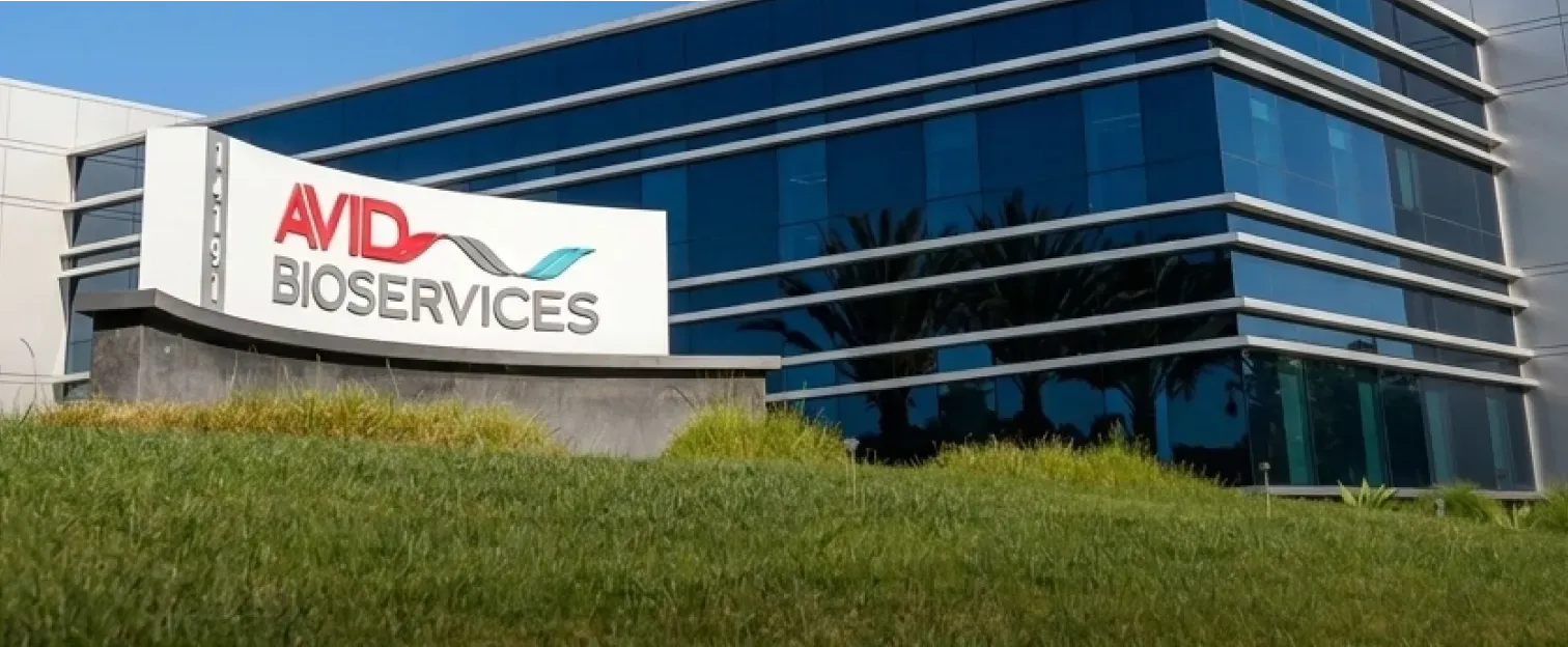 Exterior close-up of the Avid Bioservices building entrance sign