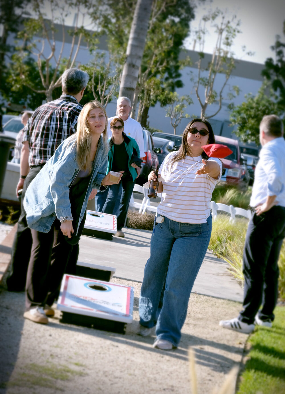 Employees walking outdoors near an office building