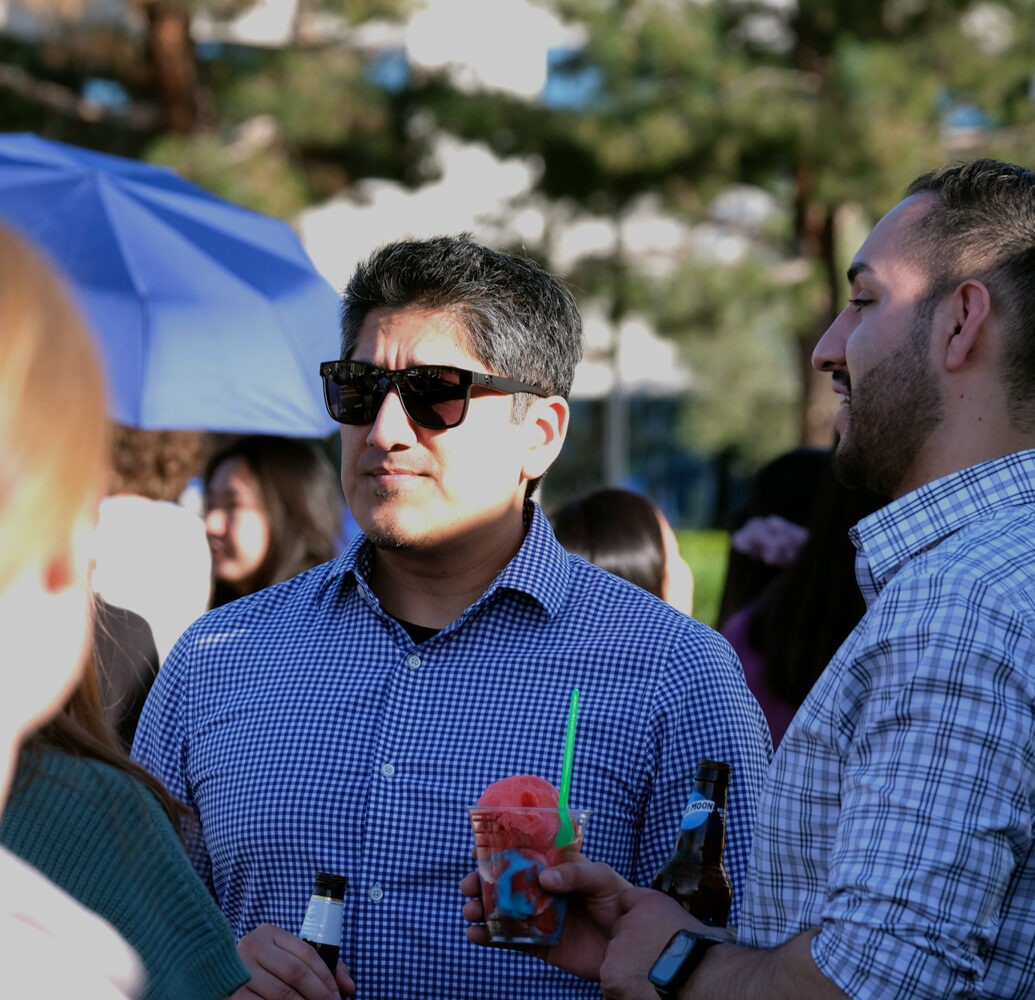 Employees gathered outdoors at a company event
