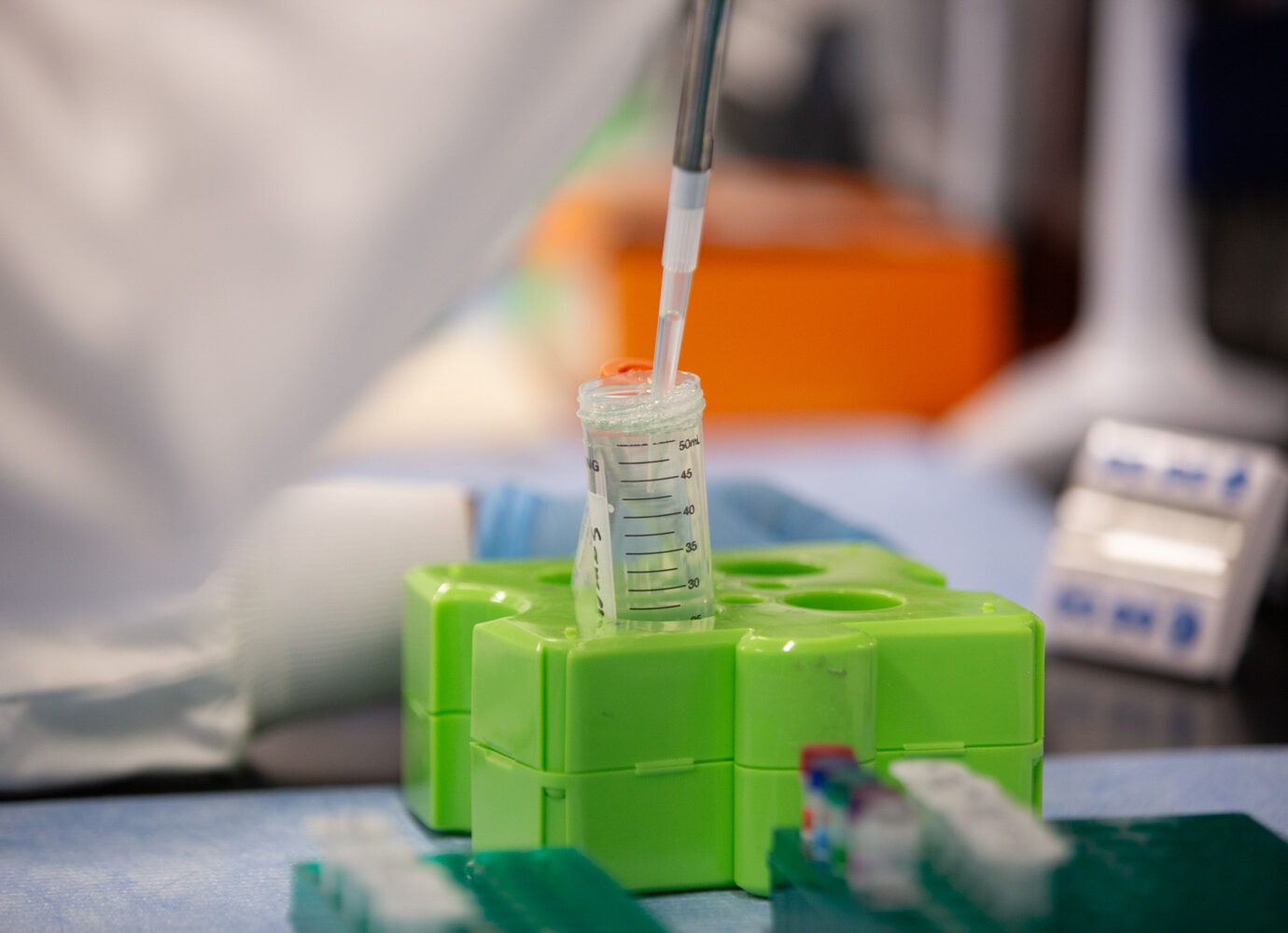 Pipette dispensing liquid into a graduated laboratory tube